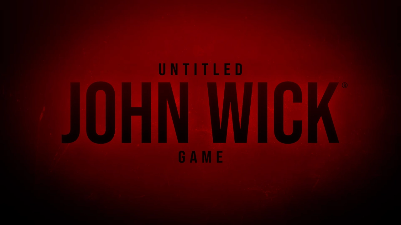 John Wick in a black suit aiming a pistol down a gold Continental hallway, official art for Saber Interactive’s untitled John Wick video game